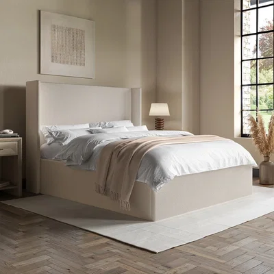Furniture123 Cream Fabric King Size Ottoman Bed with Winged Headboard - Loxley
