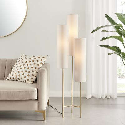The Range Suri Triple Floor Lamp 3 White Shades Brushed Brass Base - White