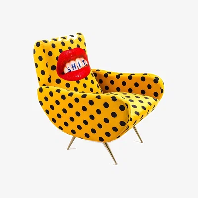 Amara wears Toiletpaper Toiletpaper Upholstered Wooden Armchair