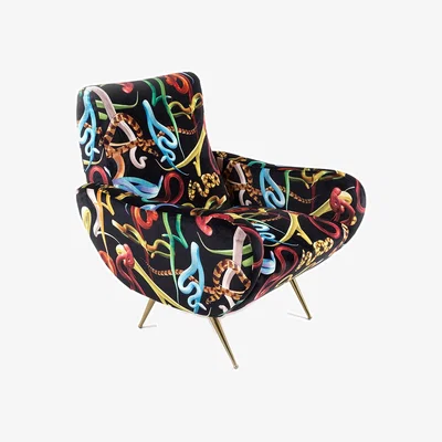 Amara wears Toiletpaper Toiletpaper Upholstered Wooden Armchair
