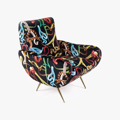 Amara Seletti wears Toiletpaper - Upholstered Wooden Armchair - Snakes