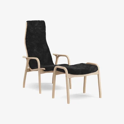 Nordic Nest Swedese Lamino armchair and footstool varnished beech/sheepskin Black