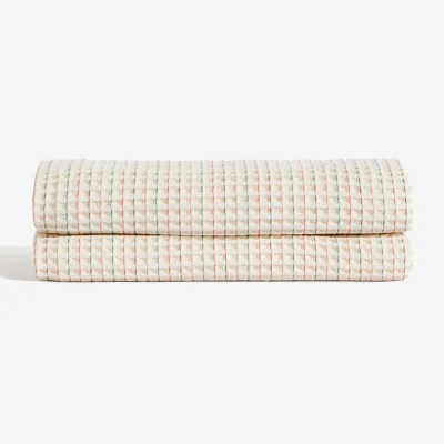 Kave Home Wufy 100% cotton waffle bedspread in a multicoloured stripe for 90 cm bed