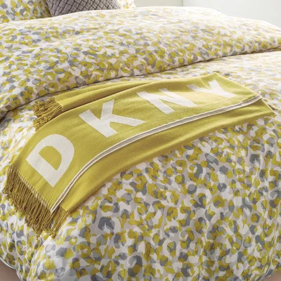 The Rug Seller Engineered Tassel Throw By DKNY in Mustard White