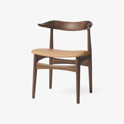 Nordic Nest Warm Nordic Cow Horn chair walnut Soavé nature