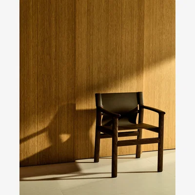 Kave Home Jan chair made of dark brown recycled leather fibres and FSC 100% solid ash wood with walnut-coloured finish