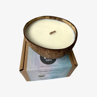 The Range Coconut Shell Candle - White / Vanilla-scented candle in a coconut shell. No crystals included. Always burn on a stable, heat-resistant surface for a
