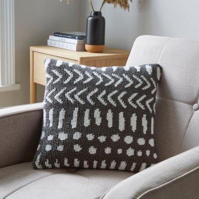Dunelm Circular Knit Arrows Cushion Grey