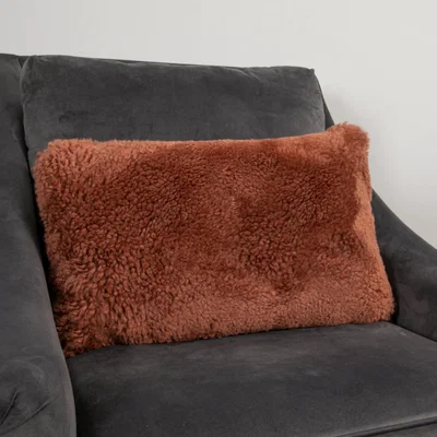 The Rug Seller Talia Bolster Sheepskin Cushion in Coral Orange35x50cm