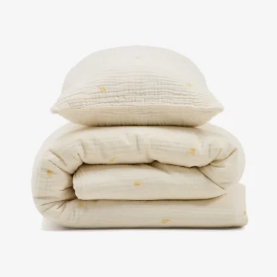 Kave Home Dorani duvet cover and pillow case set in double-gauze cotton with embroidery detail for 70cm bed