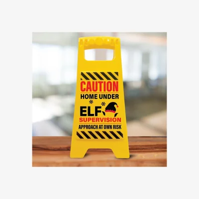 The Range Caution Home Under Elf Supervision Sign  Funny Kids Xmas Decoration - Black