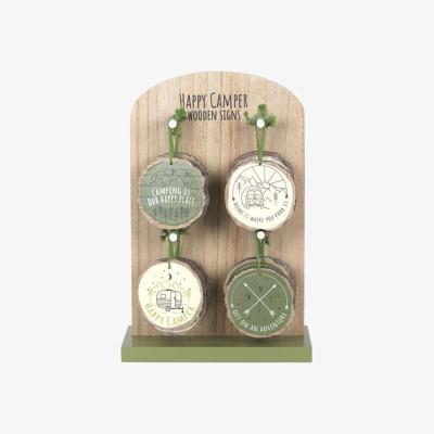 The Range Set of 16 Happy Camper Wood Slice Signs on Display - Orange