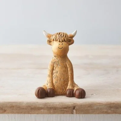 The Range Sitting Highland Cow Ornament  - Brown