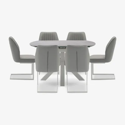 Furniture Village Fumo Swivel Extending Dining Table and 6 Faux Leather Cantilever Chairs