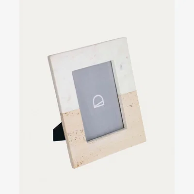 Kave Home Uria photo frame in white marble and beige stone 25 x 20 cm