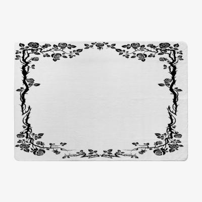 The Range Rose  Vine Silhouette Designer Rug - Black / 150cm