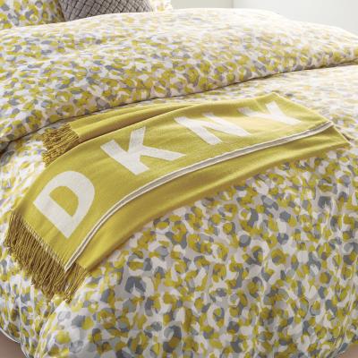 The Rug Seller Engineered Tassel Throw By DKNY in Mustard White&nbsp;127x152cm