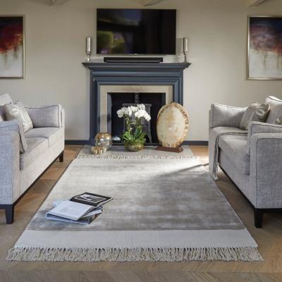 The Rug Seller Karma Tassle rugs in Cloud Grey