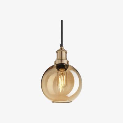 Olivia's Industville Brooklyn Tinted Glass Globe Amber Pendant / 7 Inch Brass Holder